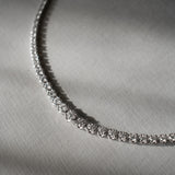 Graduated Round Cut Diamond Tennis Necklace in Enlargement Setting