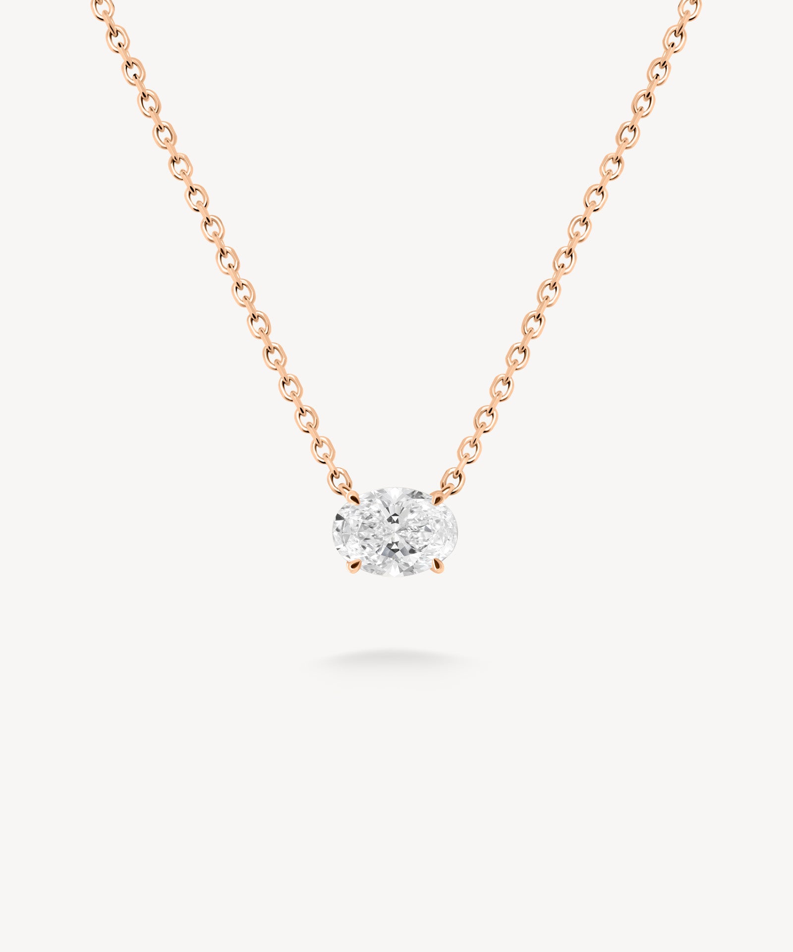 East-west oval cut diamond solitaire necklace in rose gold