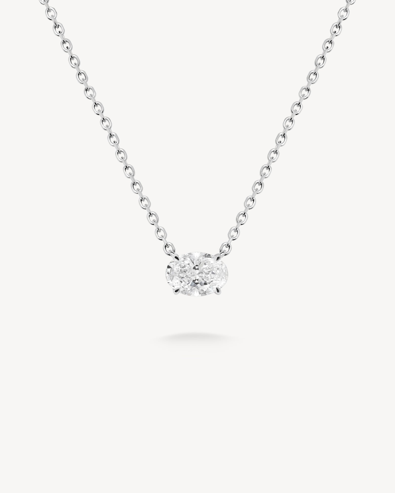 East-west oval cut diamond solitaire necklace in white gold