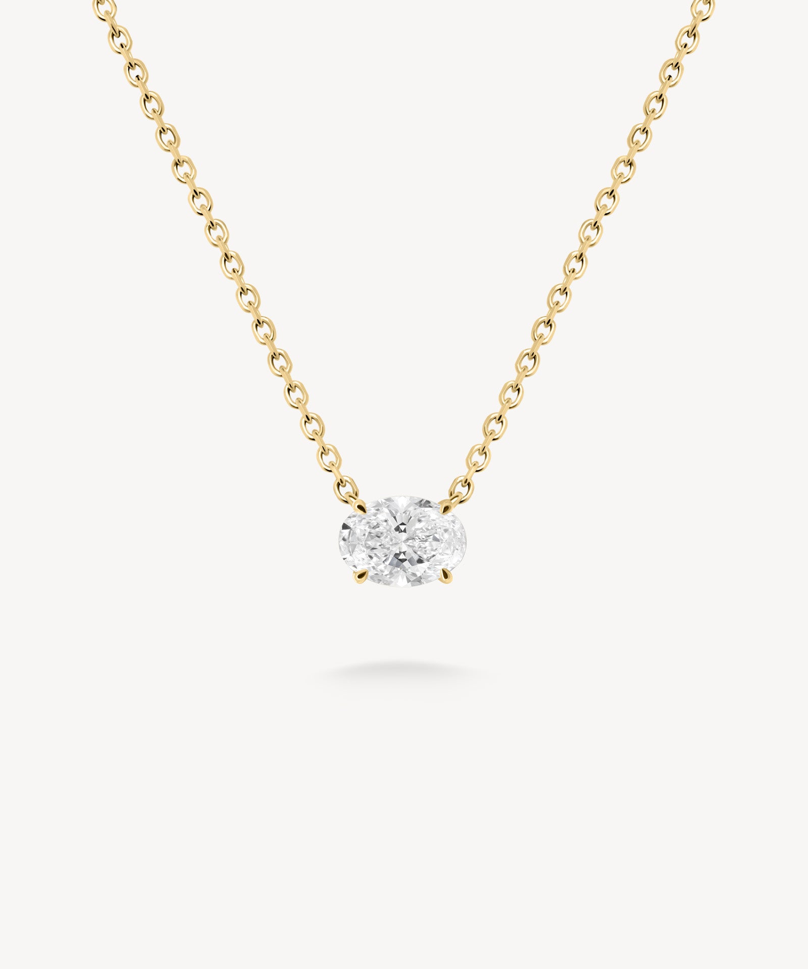 East-west oval cut diamond solitaire necklace in yellow gold
