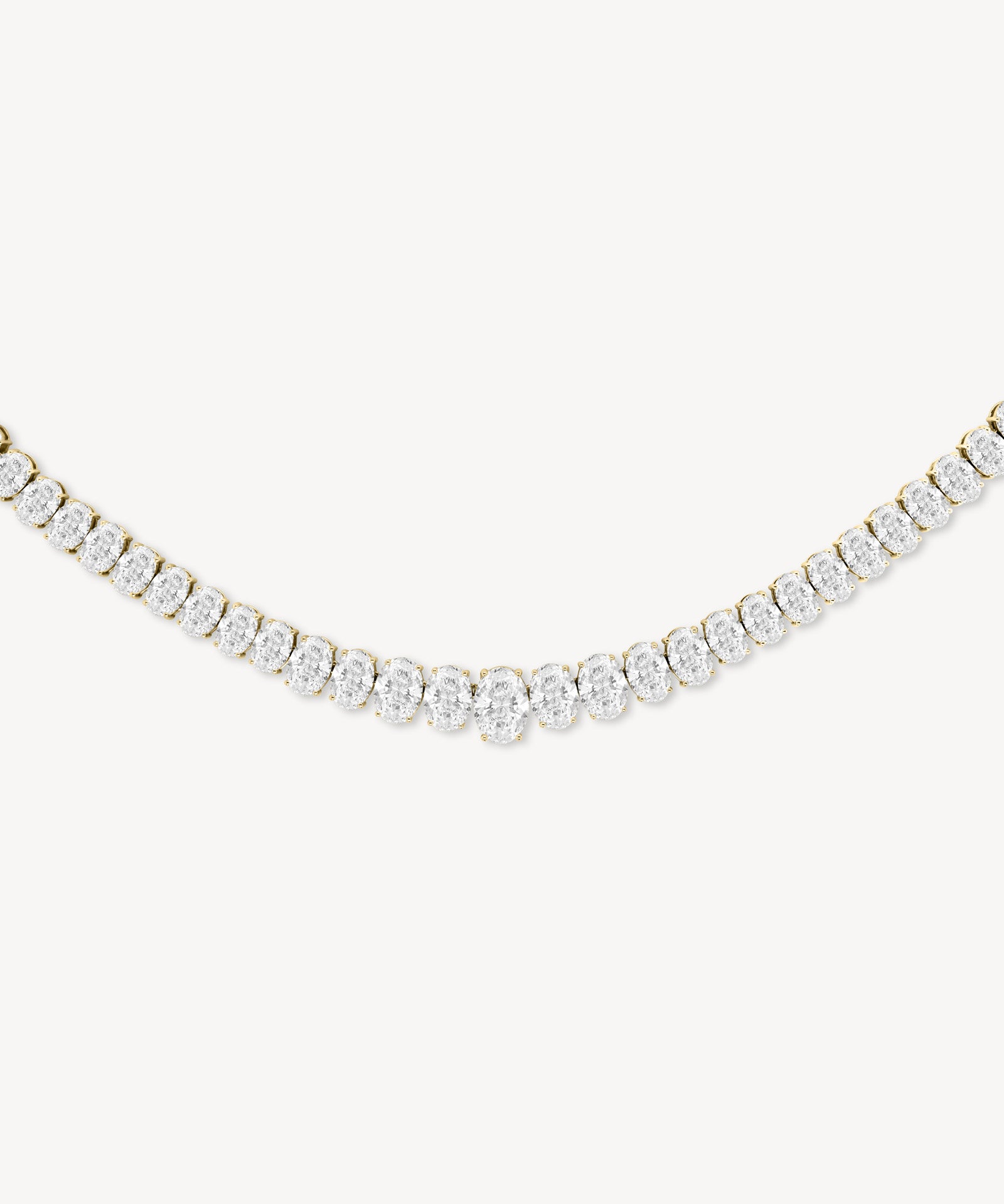 Graduated oval cut diamond tennis necklace in yellow gold