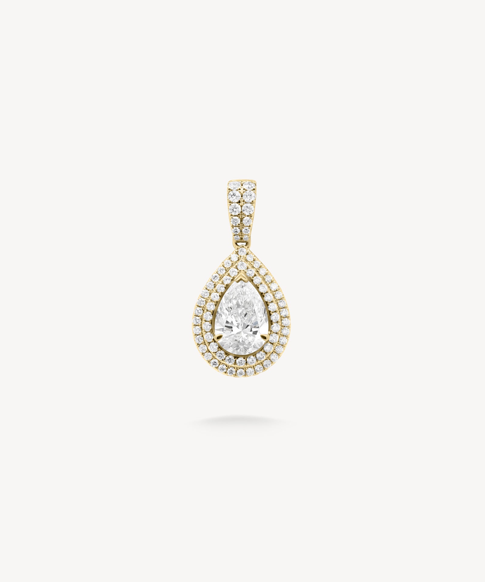 Pear cut diamond double halo pendant in yellow gold
