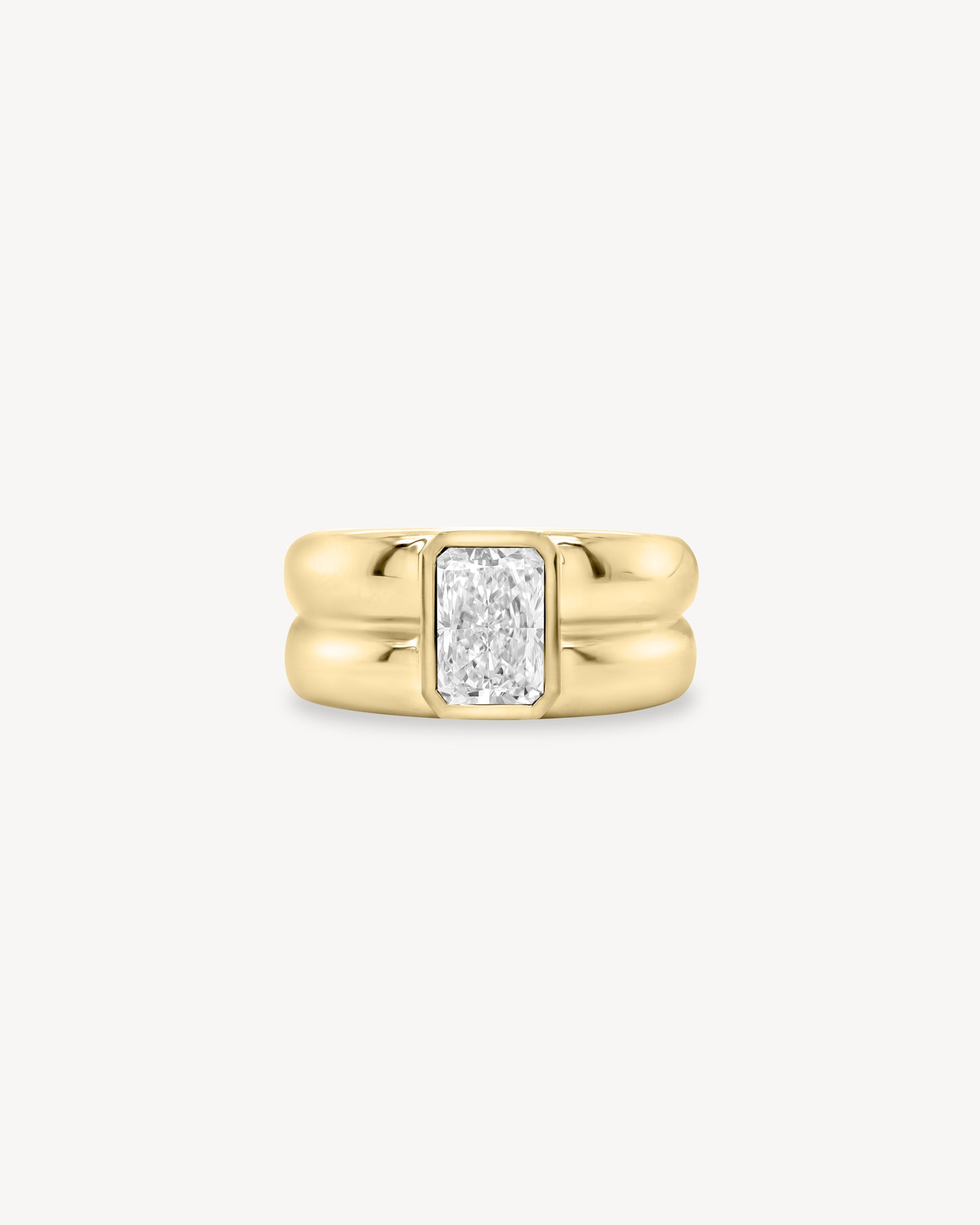 Radiant Cut diamond double gold band ring in 18K yellow gold set against a white background