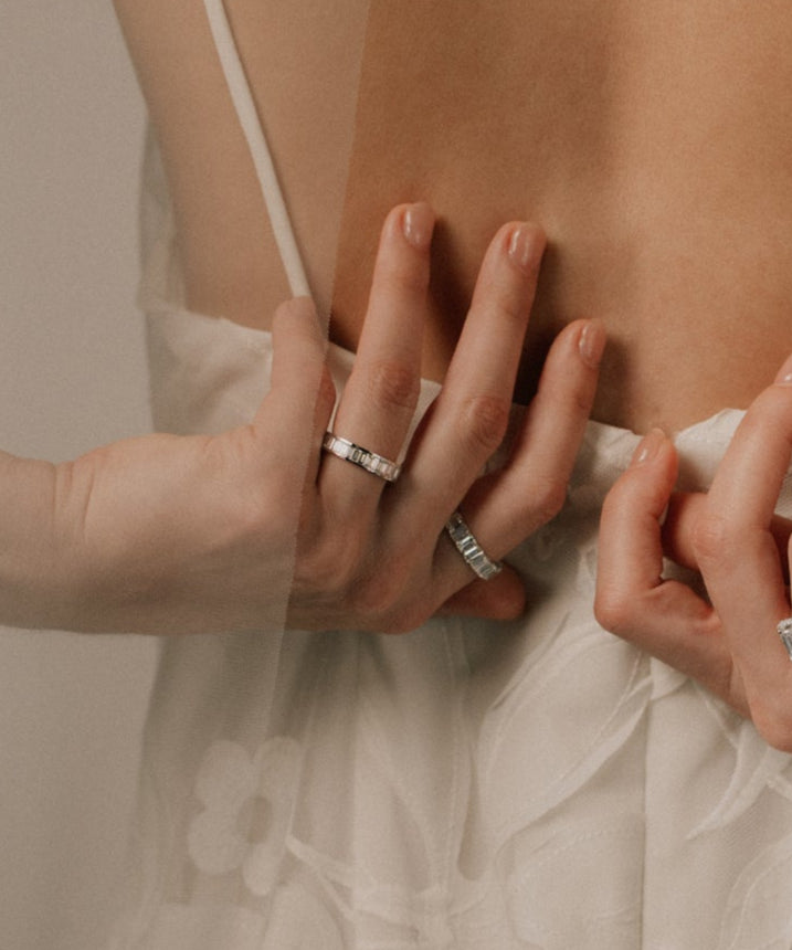 Close-up of bride's hands with baguette diamond rings