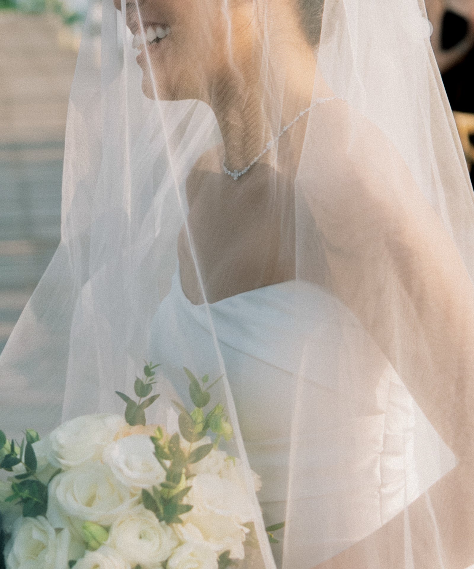 Flower diamond station necklace worn by a bride under a veil, in white gold – tinxx jewelry