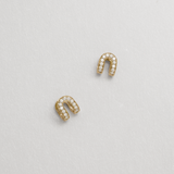 diamond huggies shaped as a horseshoe against a white background