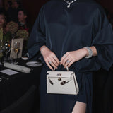 Emerald Cut Diamond Three Stone Ring With Trapezoid Cut Side Stones