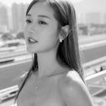 Michelle Ip in diamond teardrop earrings and diamond solitaire necklace 18K white gold