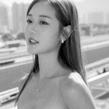 Michelle Ip in diamond teardrop earrings and diamond solitaire necklace 18K white gold