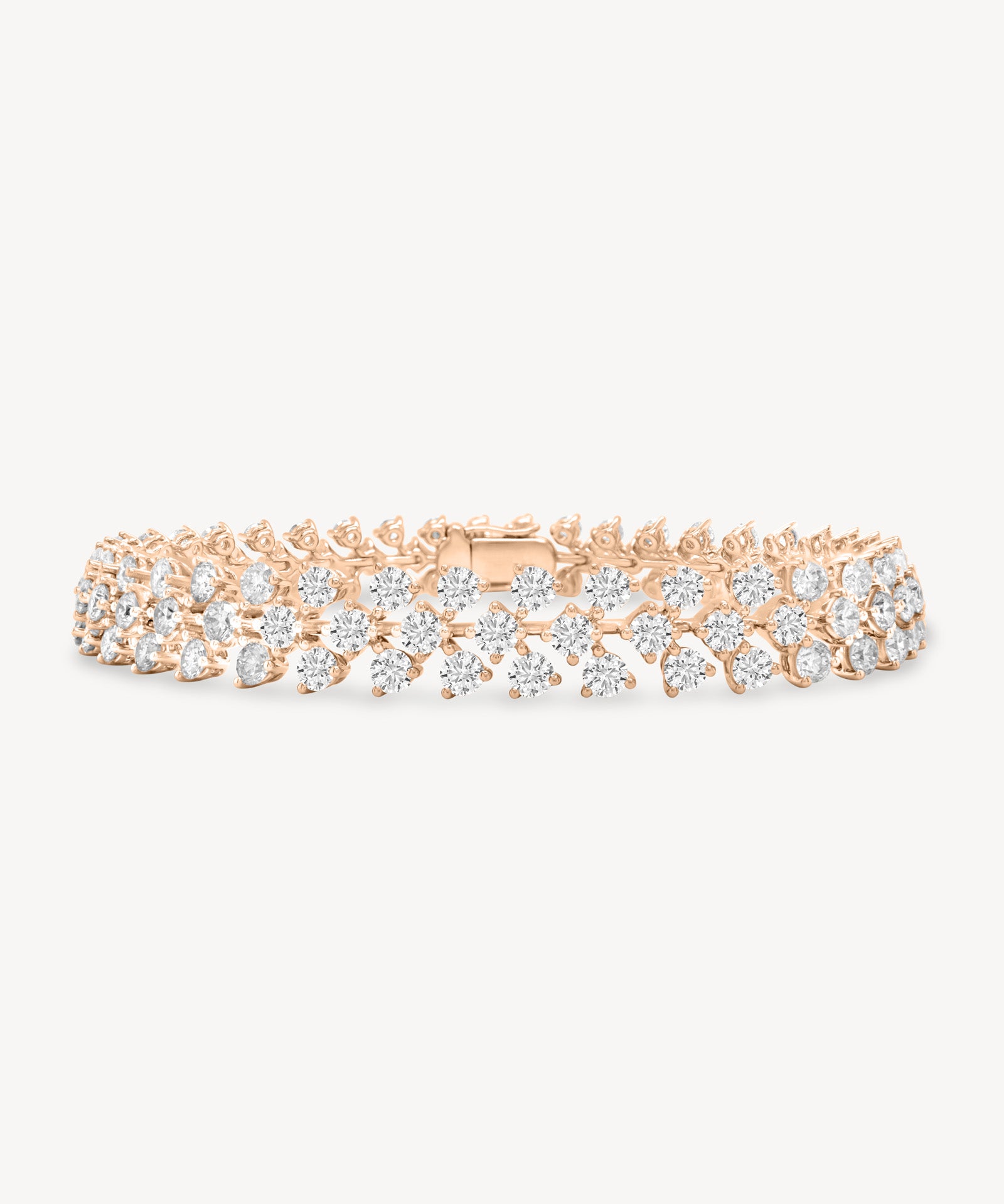 Round cut diamond vine tennis bracelet in rose gold