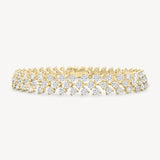 Round cut diamond vine tennis bracelet in yellow gold