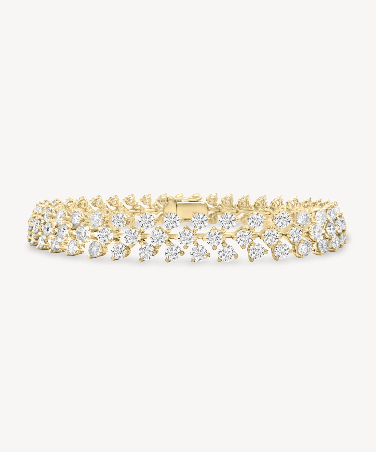 Round cut diamond vine tennis bracelet in yellow gold