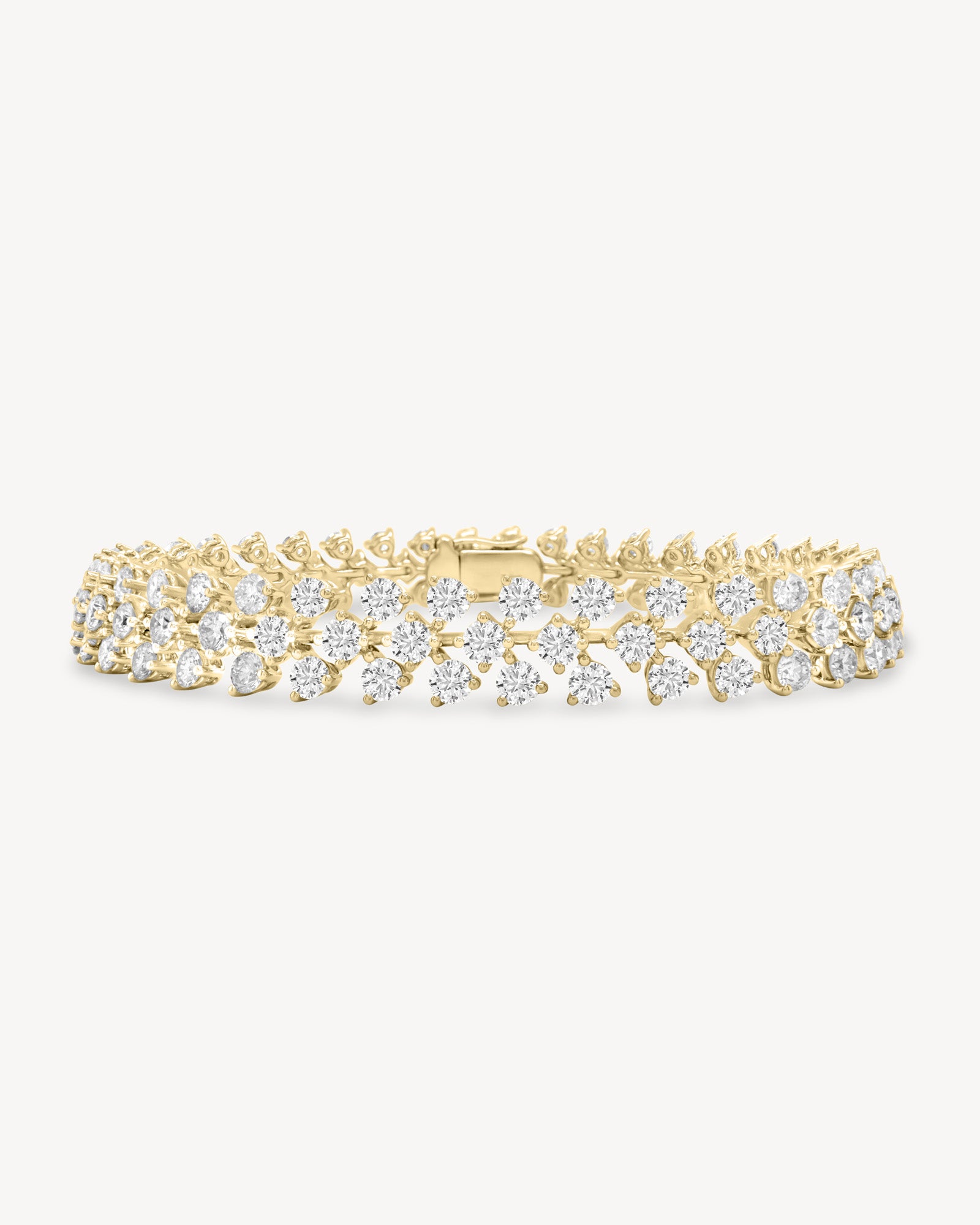 Round cut diamond vine tennis bracelet in yellow gold