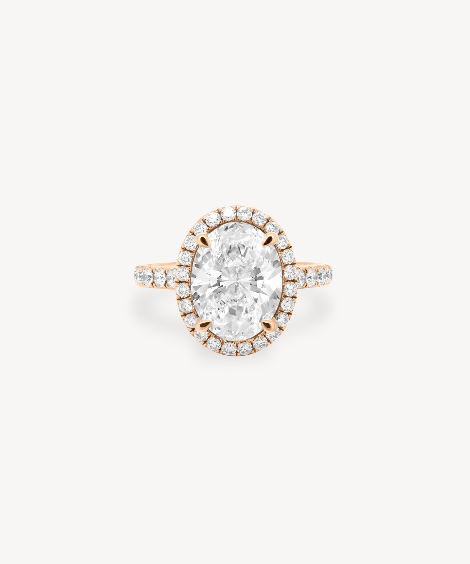 Oval Cut Diamond Halo Pavé Ring in Cathedral Setting