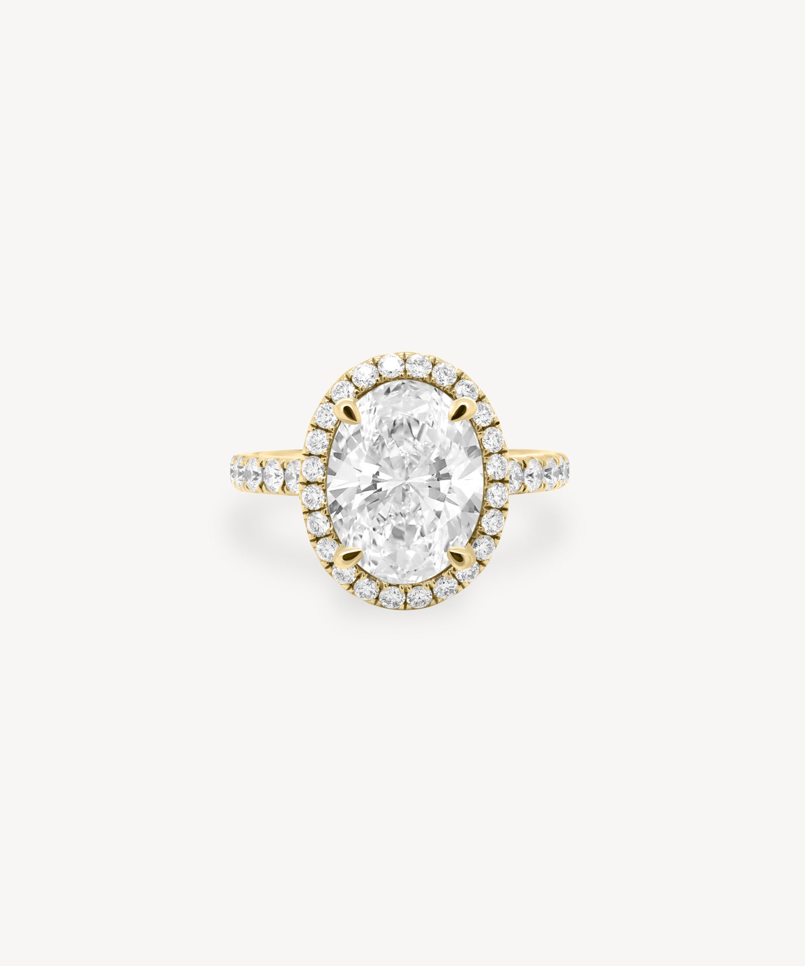 Oval Cut Diamond Halo Pavé Ring in Cathedral Setting