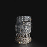 Stack of lab-grown diamond eternity rings in 18K white gold, photographed on a black background