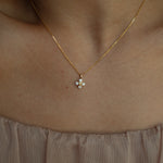 XO diamond pendant necklace in yellow gold worn on neck – tinxx jewelry