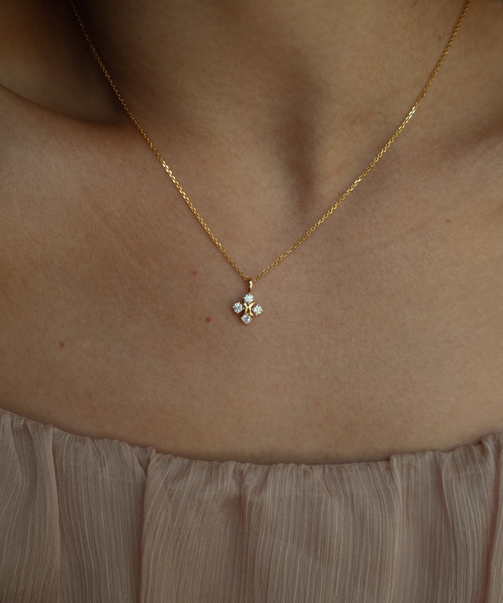 XO diamond pendant necklace in yellow gold worn on neck – tinxx jewelry