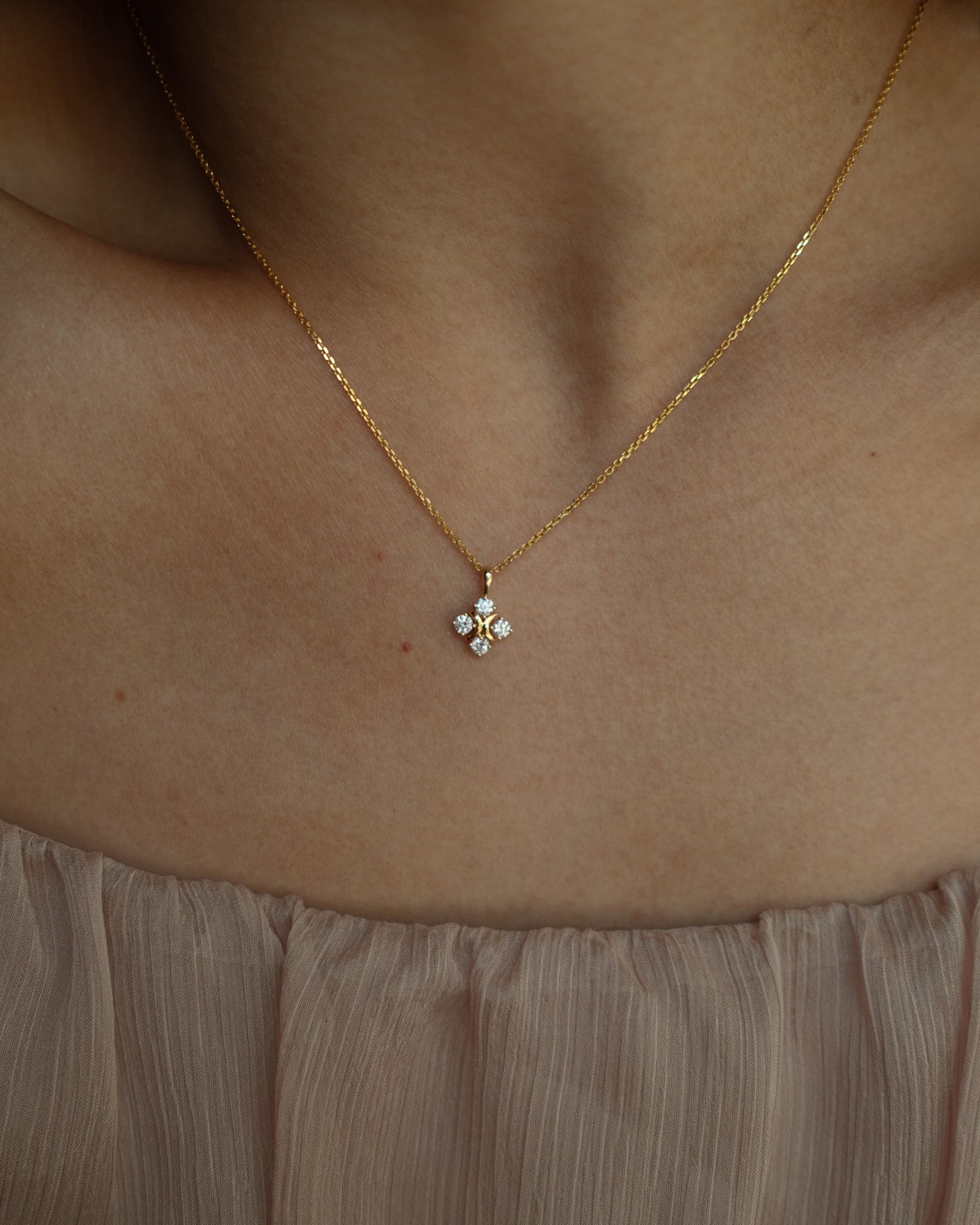 XO diamond pendant necklace in yellow gold worn on neck – tinxx jewelry